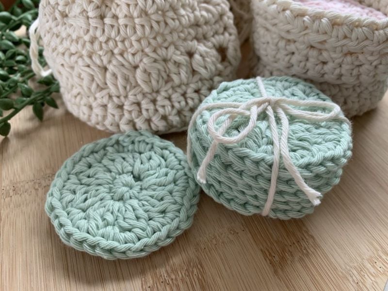 Crocheted pads in mint green color. Free Cotton Yarn Pads Crochet Pattern by Hookfully
